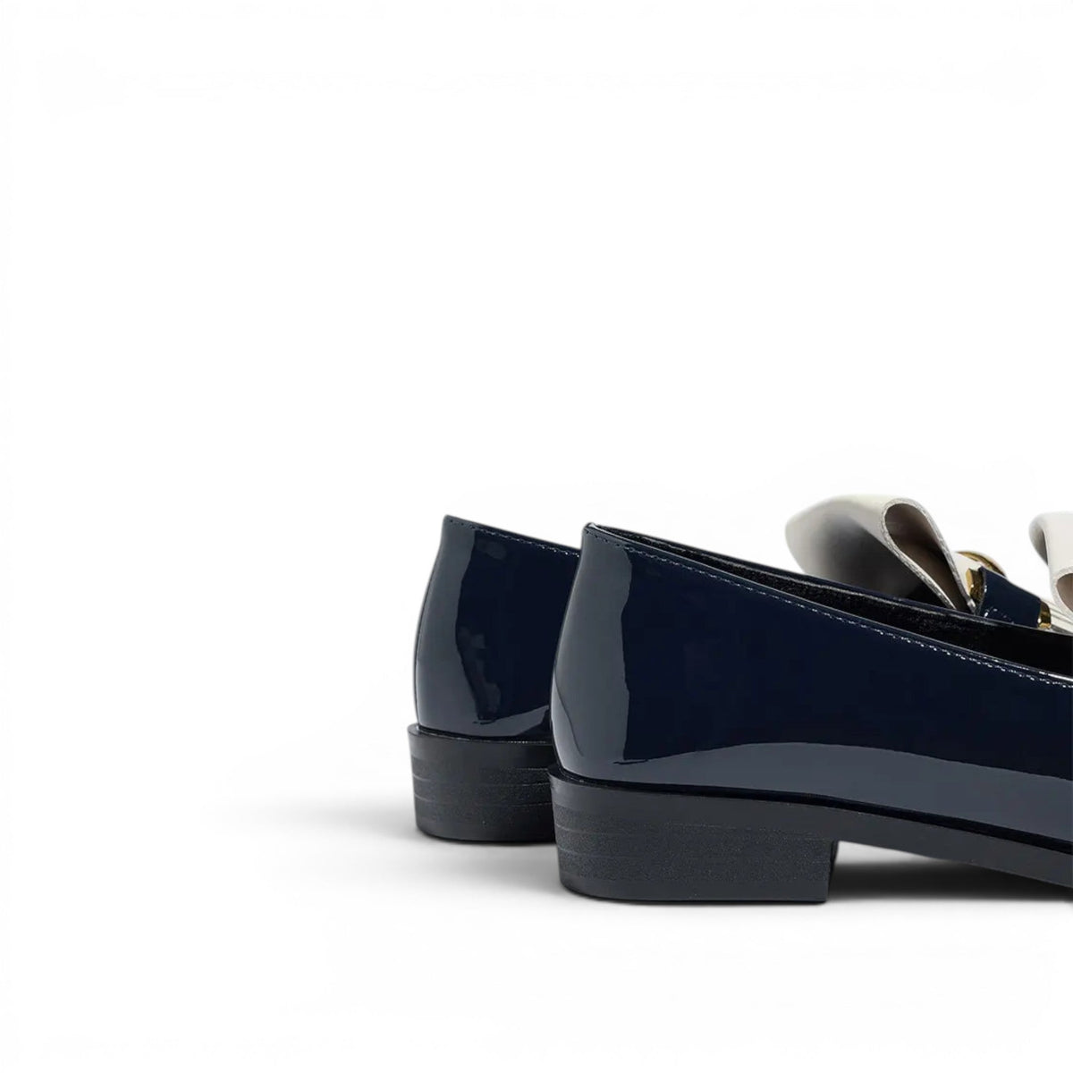 Understated Liliane Patent Loafers with Fringe Detail
